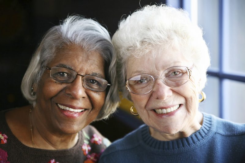 Two senior women smiling together